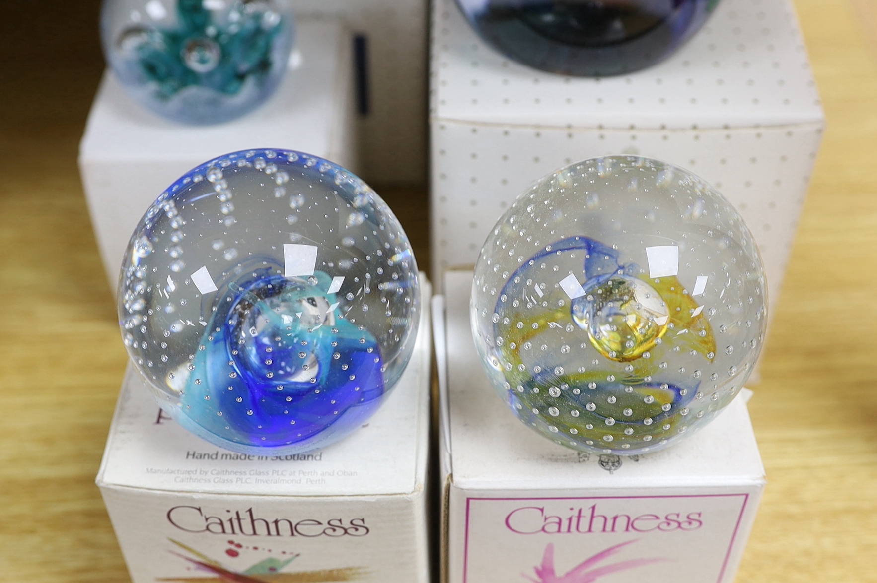 Eight Caithness paperweights, boxed